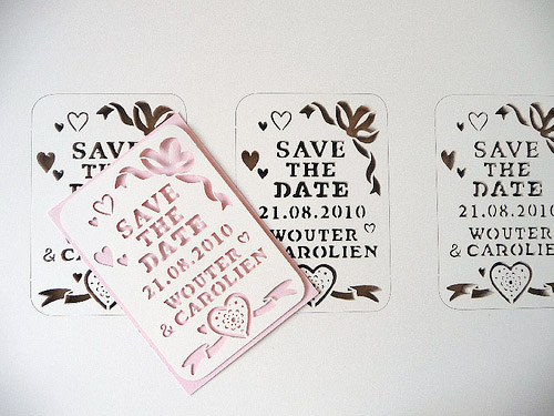 These papercut Save the Dates and wedding invitations by Julene Harrison are