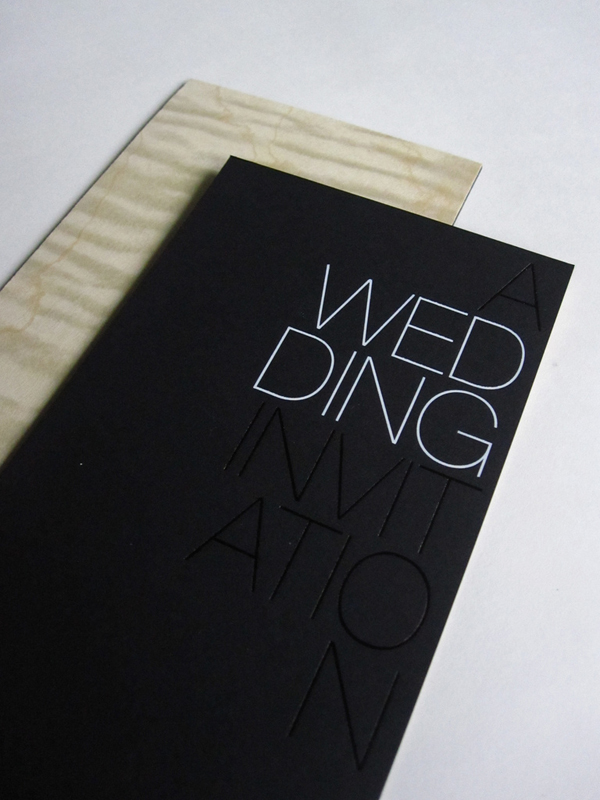 The invitations were triple bonded black paper stamped with black and white