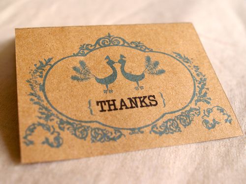 The reverse side of the favor labels features another peacock and a thank 