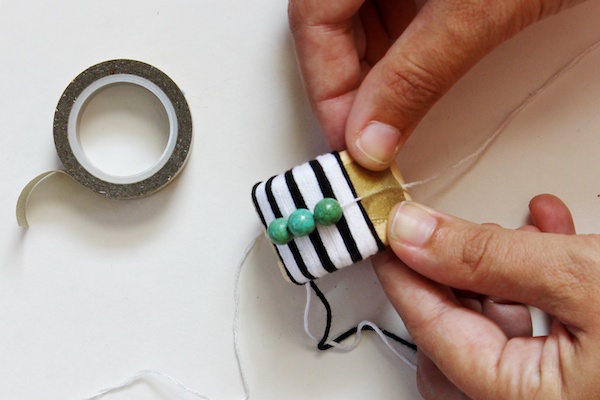 DIY Black + White Striped Napkin Rings via Oh So Beautiful Paper