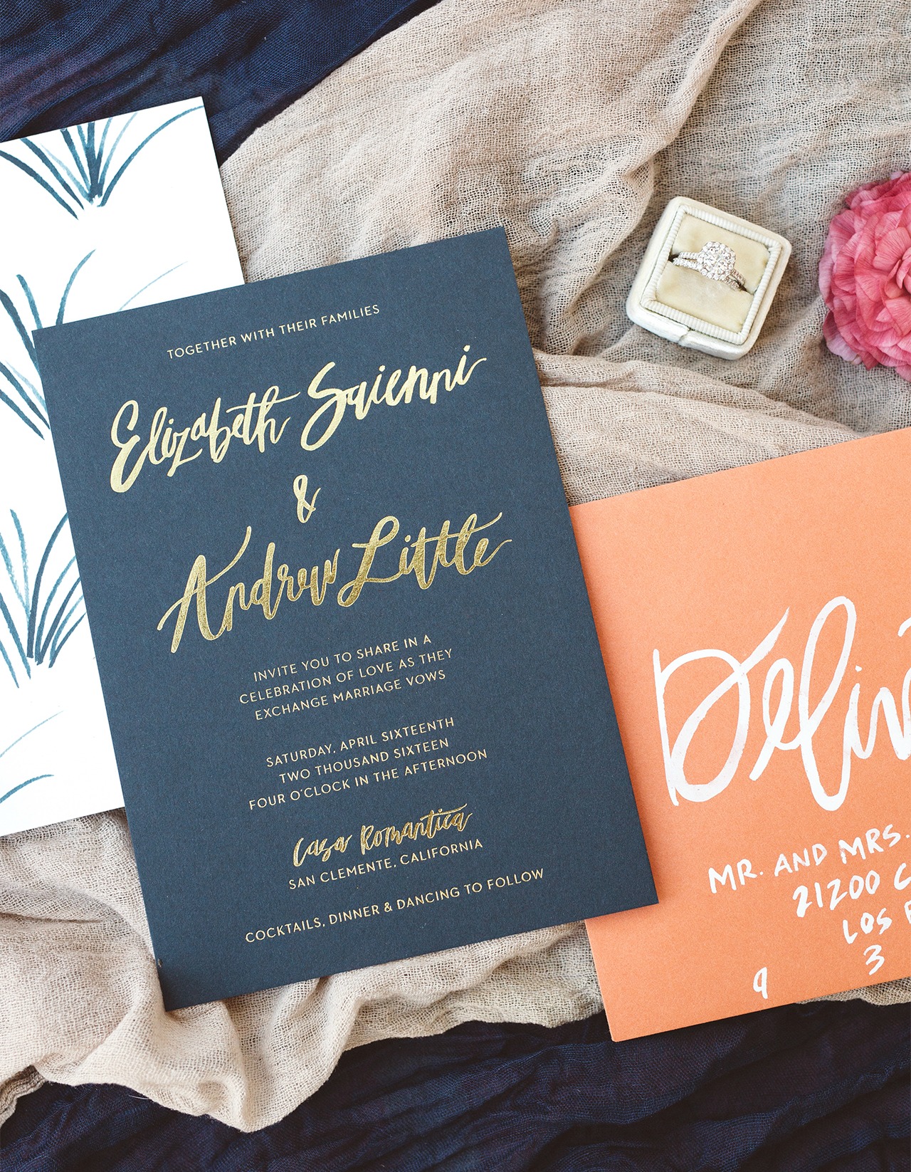 Elegant and semi-formal beach-inspired brush lettered gold and navy wedding invitations with coral envelopes by Goodheart Design and Czar Press