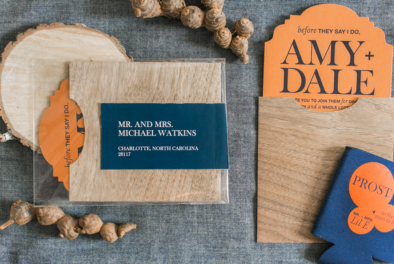 Rustic Orange, Navy, and Wood Rehearsal Dinner Invitations by Atheneum Creative