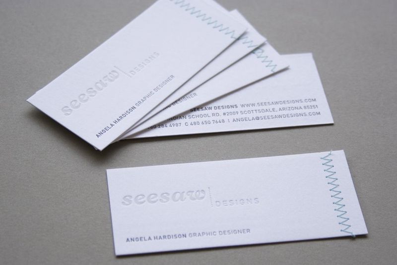 Letterpress-business-cards-with-stiching-seesaw-designs